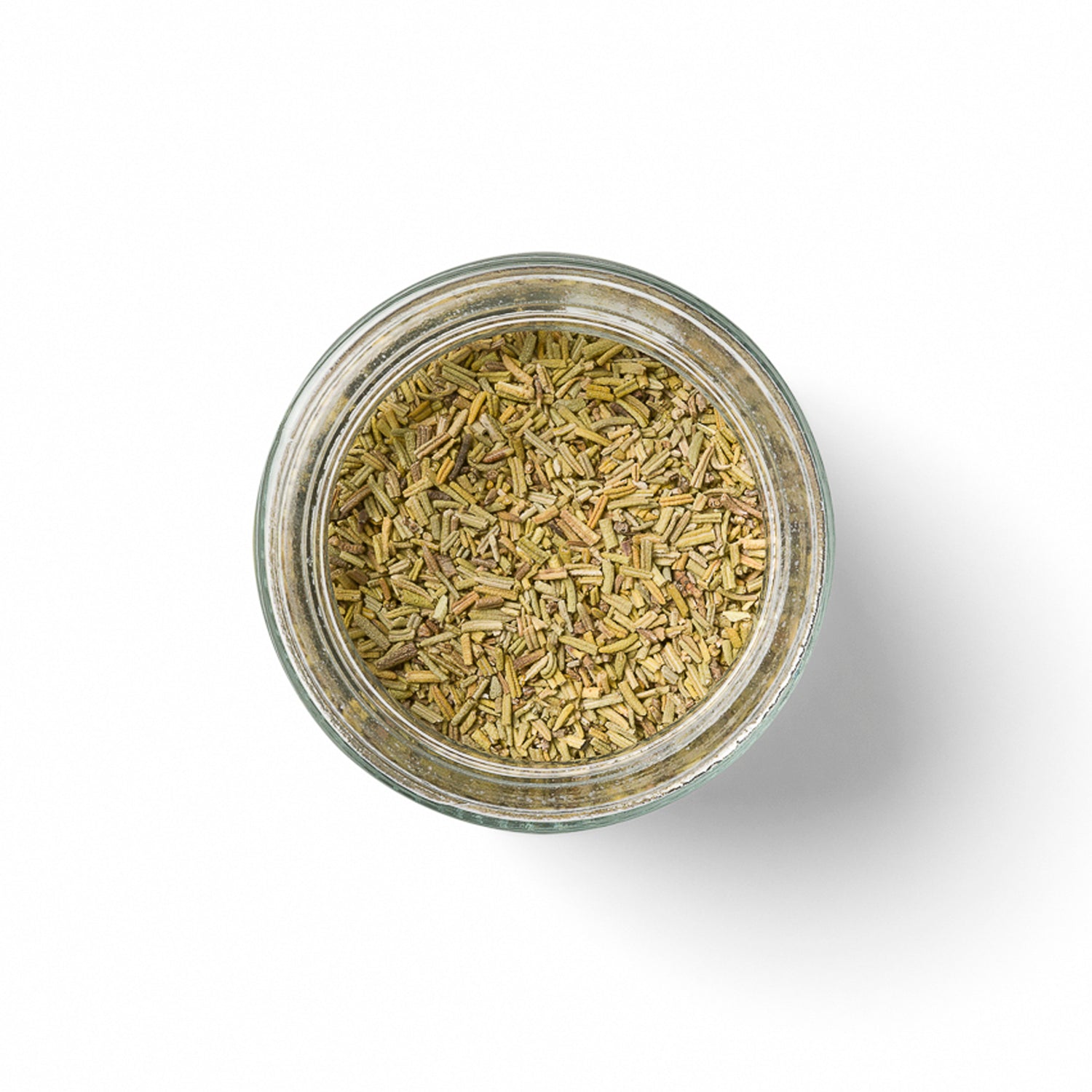 Open glass jar filled with dried organic rosemary on a white background - terreign